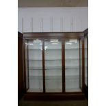 A large mahogany three door shop display cabinet, made by F. Maund & E. Berg Ltd., Showcases &