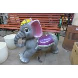 A painted baby elephant fairground ride seat