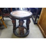 An African carved softwood occasional table