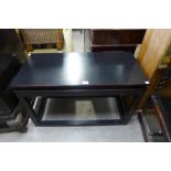 A Japanese black lacquered side table