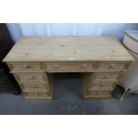 A pine pedestal desk