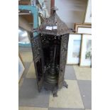 A French style cast iron oil lamp and stand