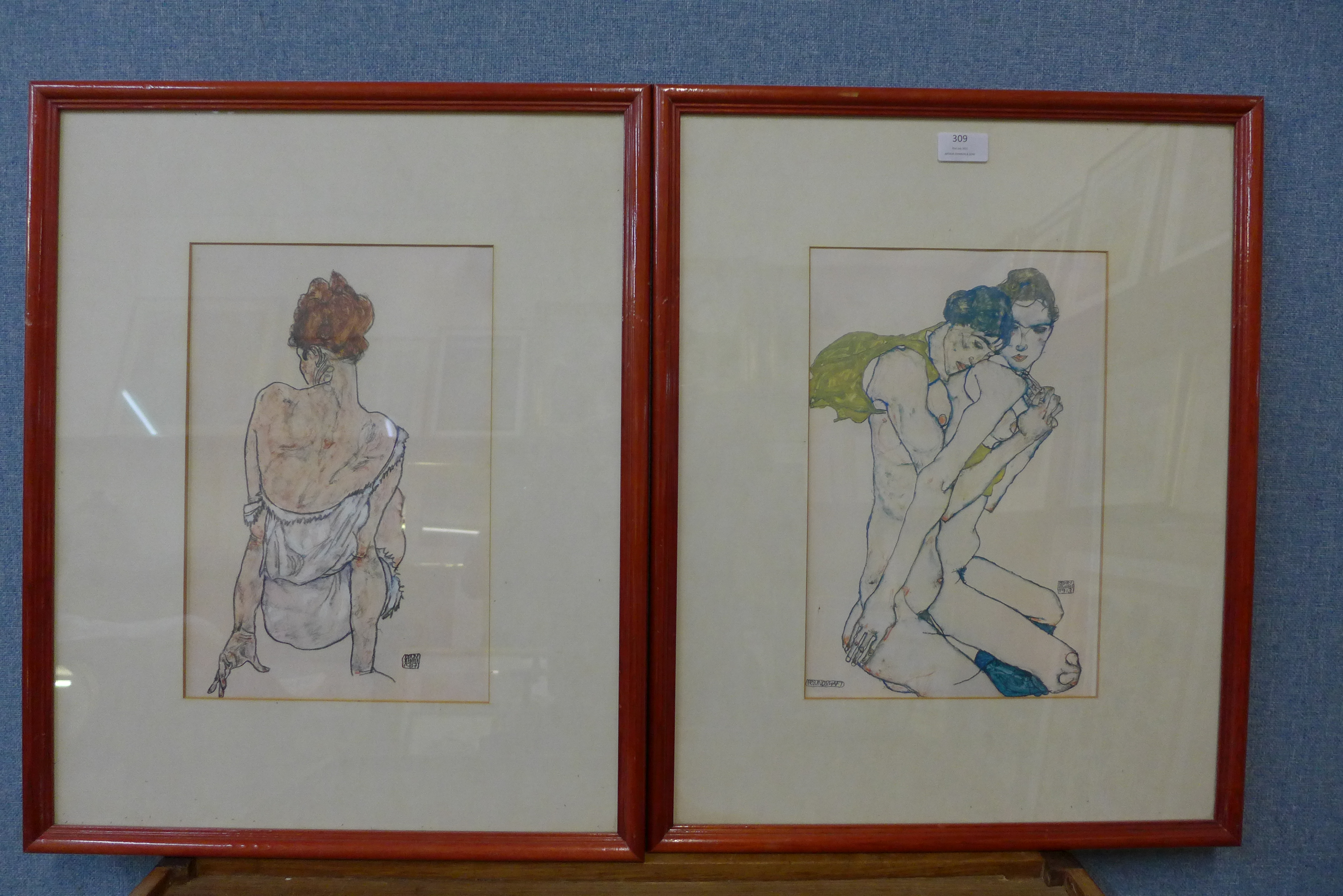 A pair of German portrait prints, framed