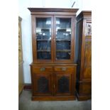 A Victorian carved walnut bookcase