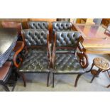 A set of four Regency style mahogany and green leather chairs