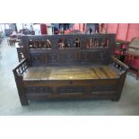 A late 17th/early 18th Century continental carved elm settle