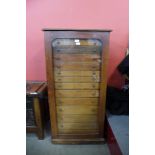 A Victorian mahogany museum collectors cabinet, with single glazed door revealing thirteen drawers