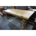 A large pine two drawer farmhouse kitchen table