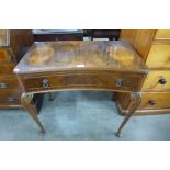 A figured walnut single drawer side table