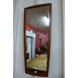 A teak framed mirror