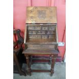 An Arts and Crafts Aztec Revival beech and copper bureau de dame