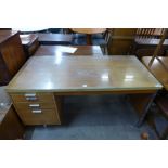 A teak and chrome desk