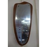 A teak framed mirror