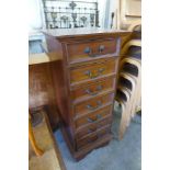 A small French style mahogany semainier chest of drawers