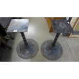 A pair of cast iron pub table bases