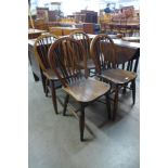 A set of four 19th Century ash and elm Windsor kitchen chairs