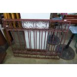 A pair of painted wrought iron gates