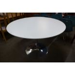 An Eero Saarinen style chrome based circular table