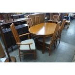 A Morris Furniture teak extending dining table and six chairs