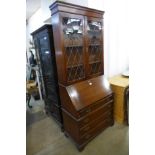 An oak bureau bookcase