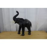 A leather figural baby elephant