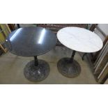 A pair of cast iron and marble topped pub tables