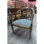 An Edward VII inlaid mahogany tub chair