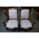 A pair of 19th Century French Empire style mahogany and upholstered fauteuils