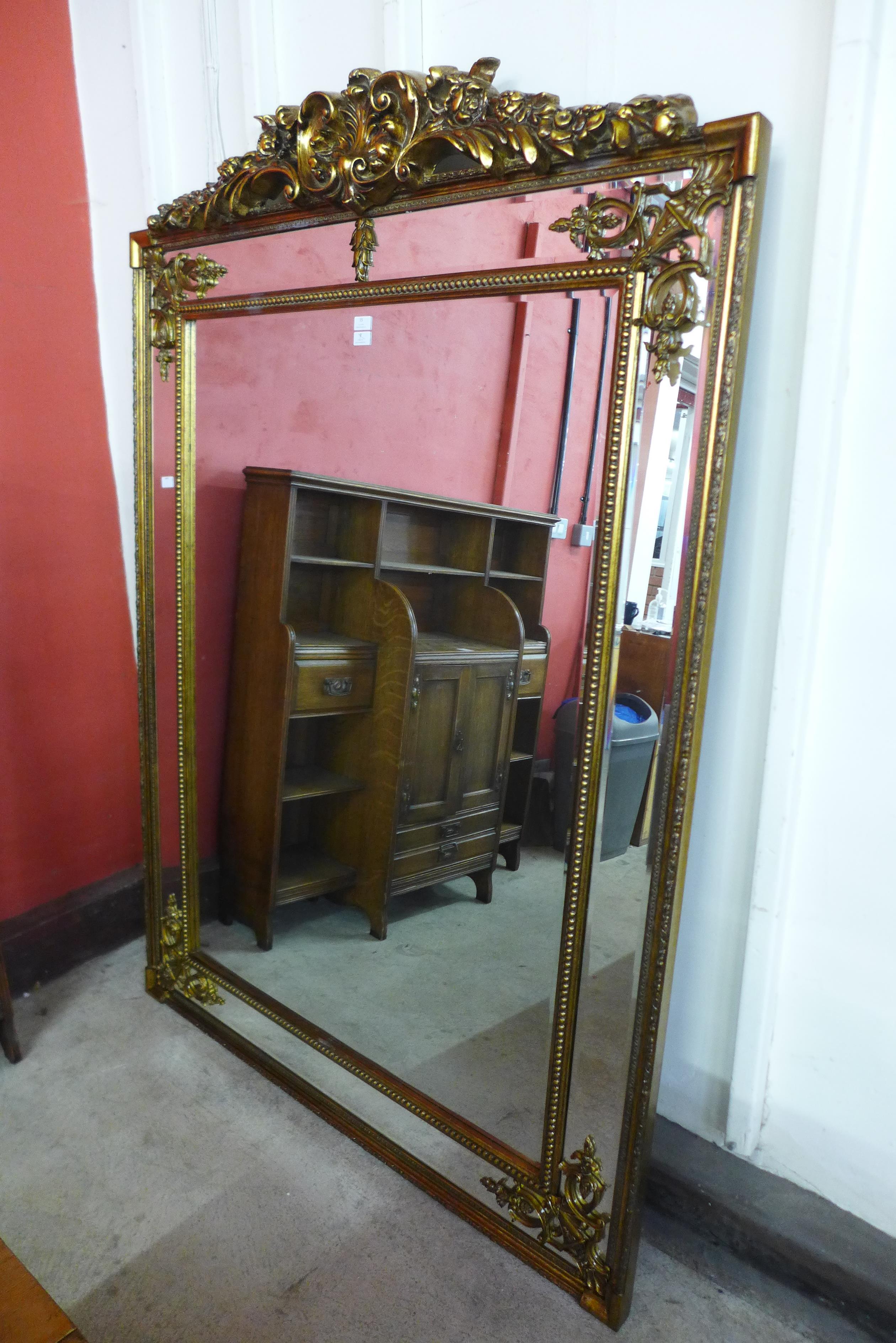 A large French style gilt framed mirror with crest, 191 x 135cms (M24238) #