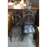 A set of beech and elm wheelback kitchen chairs