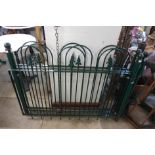 A set of three painted wrought steel fence panels