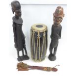 Two carved African figures, a drum and a knife