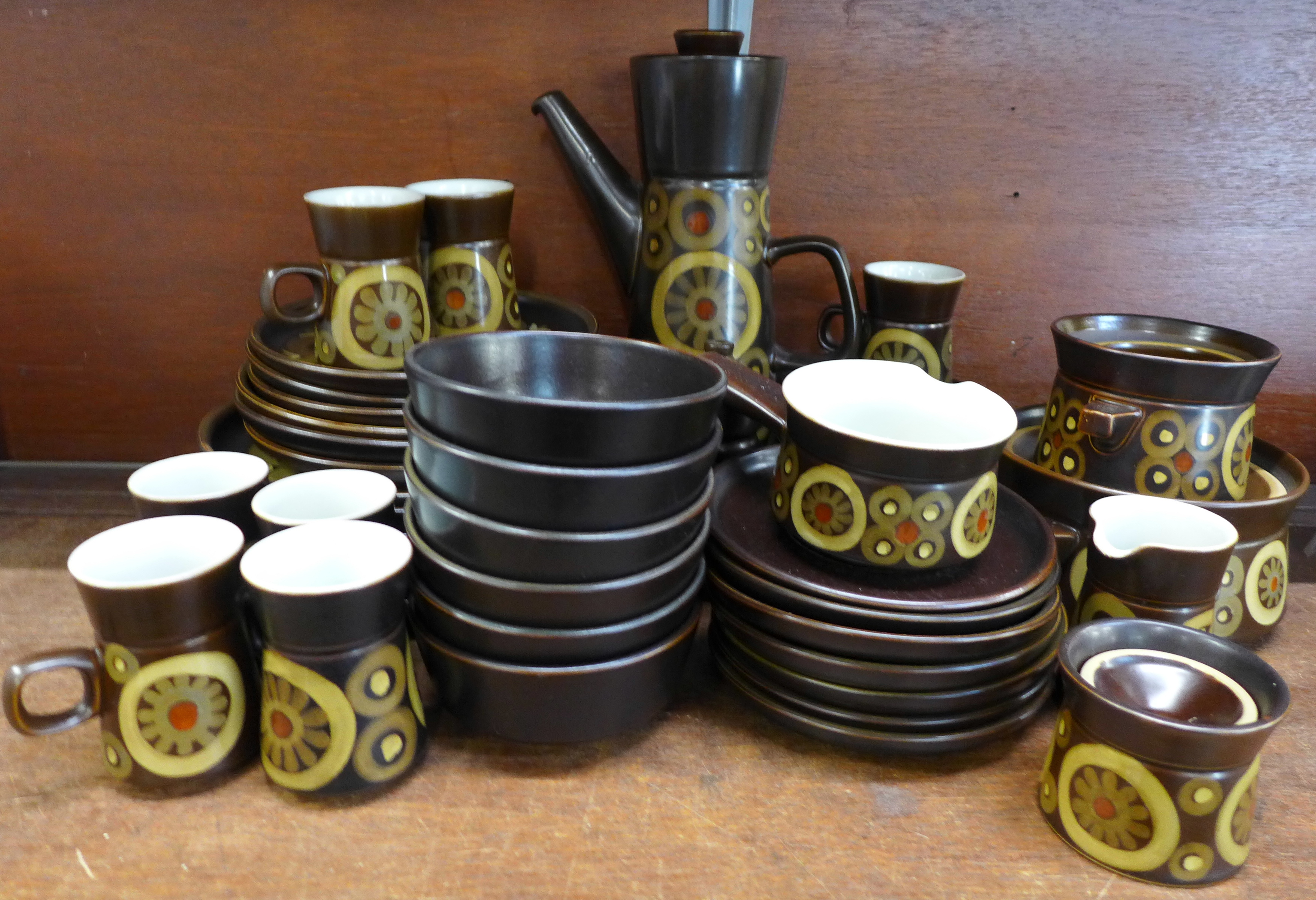 A Denby Arabesque dinner and coffee service including six side plates, six plates, seven mugs and