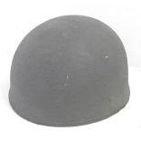 A WWII Army helmet, the inner head piece marked BMB 1942 7¼