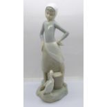A Lladro figure of a girl with duck