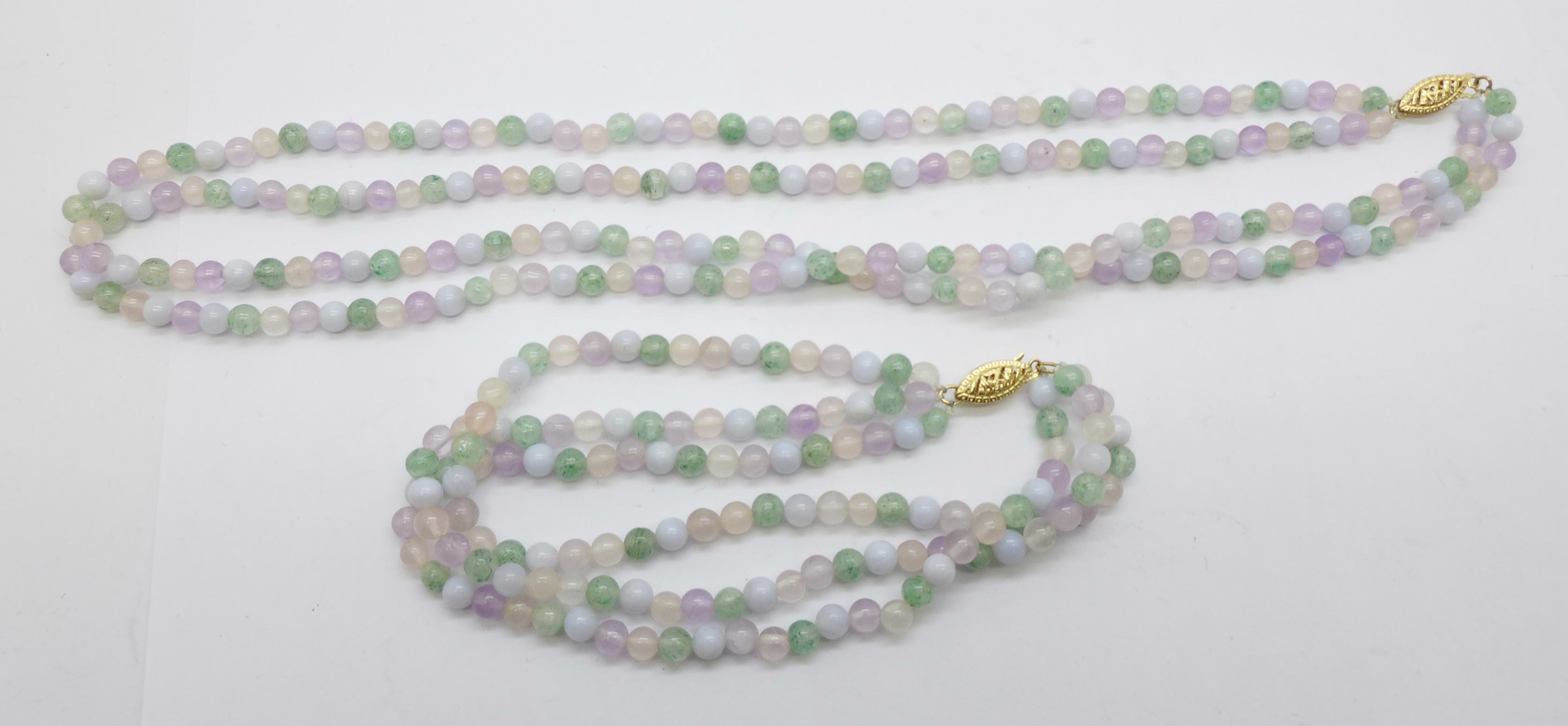 A stone bead necklace and matching bracelet with 14ct gold clasps