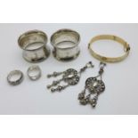 A pair of silver napkin rings, Birmingham 1918, 21g, two silver rings, one Birmingham 1976, a pair