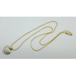 An 18ct gold and diamond pendant on an 18ct gold chain, set with eight diamonds, width of pendant