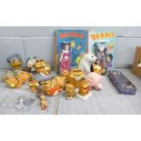 A collection of toys, figures, etc., including Garfield, two early Beano annuals, Disney character