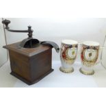 A coffee grinder and two Queen Elizabeth II Golden Jubilee mugs