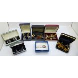 A collection of cufflinks, tie pins and a hallmarked silver napkin holder/clip