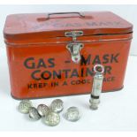 A WWII ARP gas mask tin, an ARP whistle and six ARP buttons