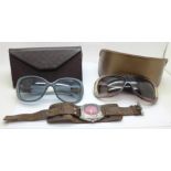 Two pairs of lady's Gucci sunglasses, cased and a Fossil wristwatch