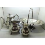 A three piece plated tea service and a basket