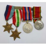 A set of four WWII medals including Africa Service Medal to 614500 J.H. Buys