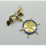 A silver and enamel ship's wheel pendant brooch