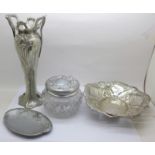 An AE Williams cast pewter Art Nouveau vase, two dishes and a lidded glass pot