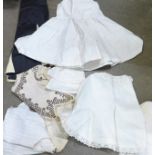 A collection of linen including a christening gown, bonnet, etc.