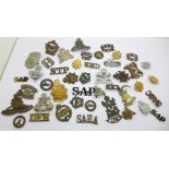 A collection of approximately 43 badges and buttons, etc., including Witwaterstrand Rifles, some