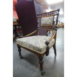 An Arts and Crafts carved walnut lady's chair